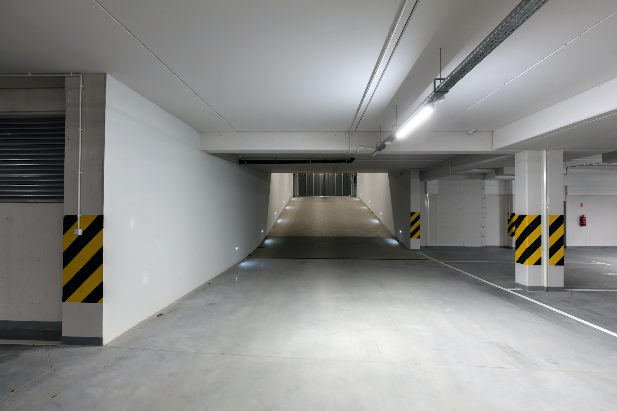 Underground empty parking garage. Gate and gateway